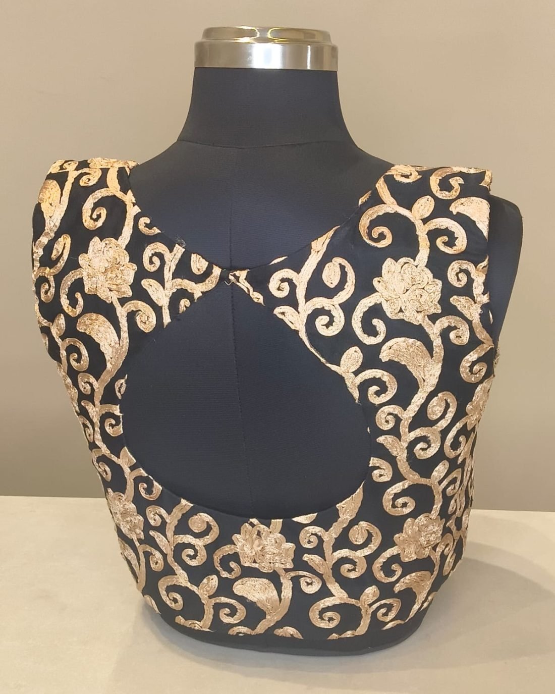 Black Gold Brocade Keyhole Blouse photographed on a dress form at the Ananta Designs boutique