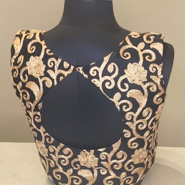Black Gold Brocade Keyhole Blouse photographed on a dress form at the Ananta Designs boutique