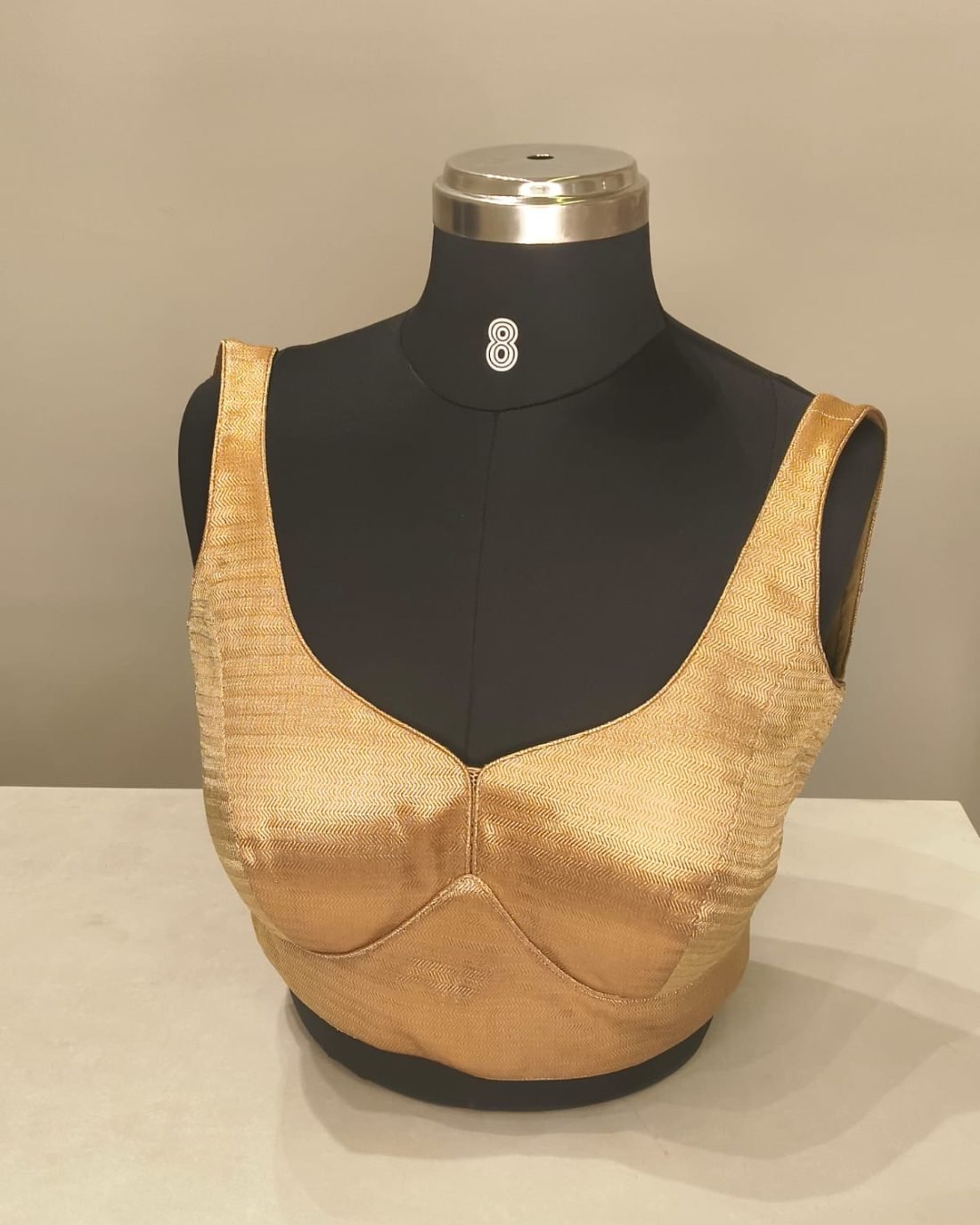 Gold Satin Sweetheart Blouse photographed on a dress form at the Ananta Designs boutique