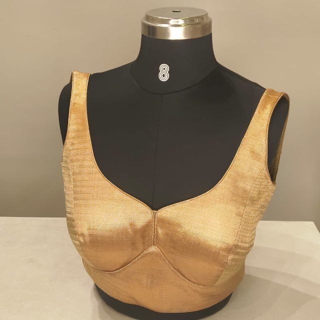 Gold Satin Sweetheart Blouse photographed on a dress form at the Ananta Designs boutique
