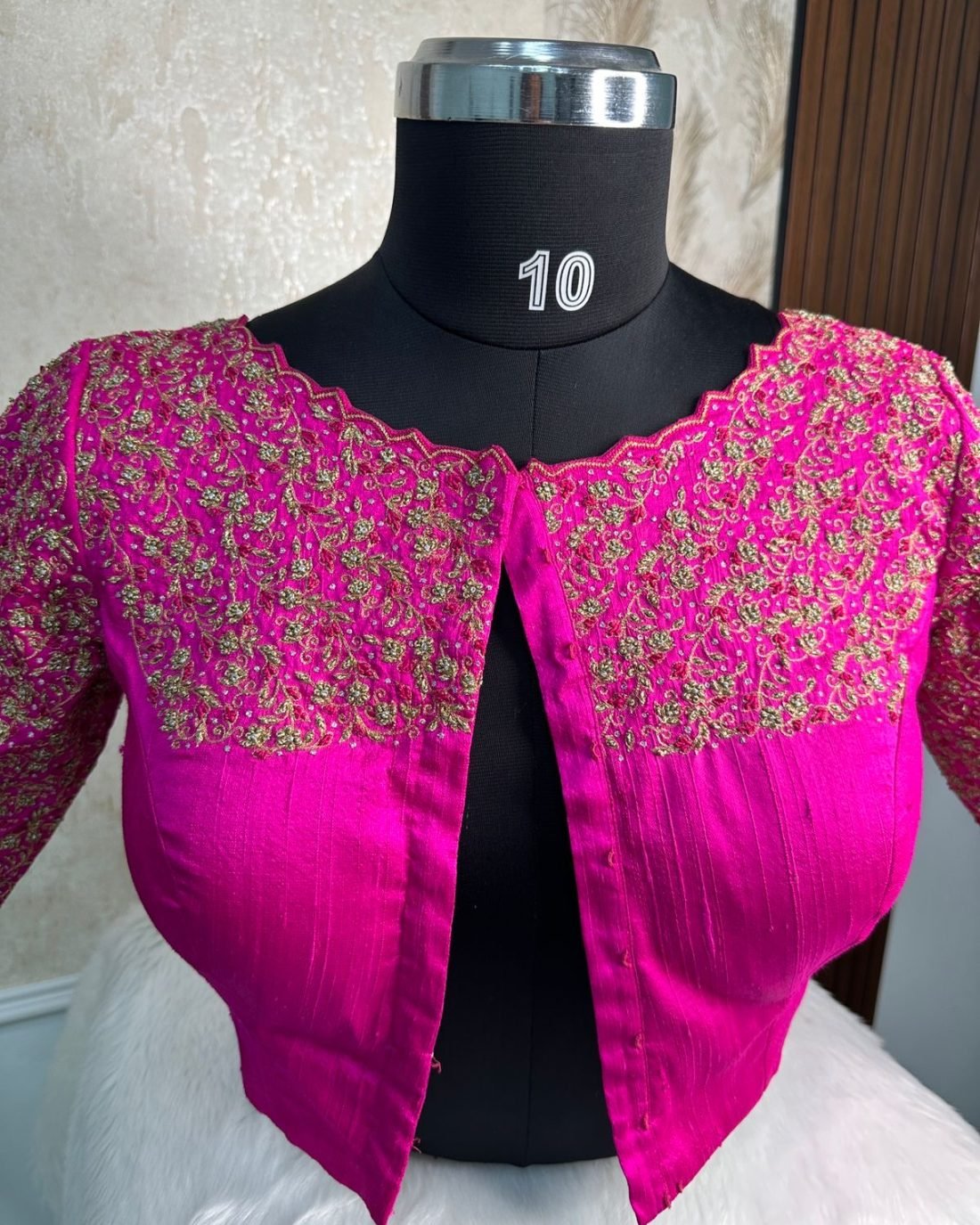 Magenta Gold Embroidered Blouse photographed on a dress form at the Ananta Designs boutique