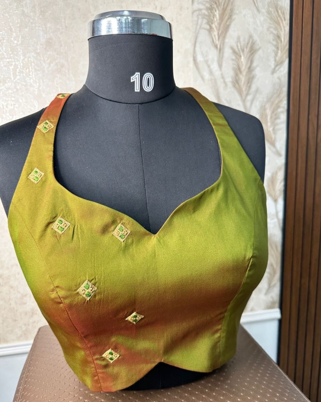Olive Silk Gold Butti Blouse photographed on a dress form at the Ananta Designs boutique