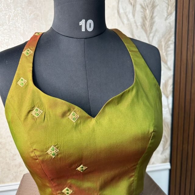 Olive Silk Gold Butti Blouse photographed on a dress form at the Ananta Designs boutique