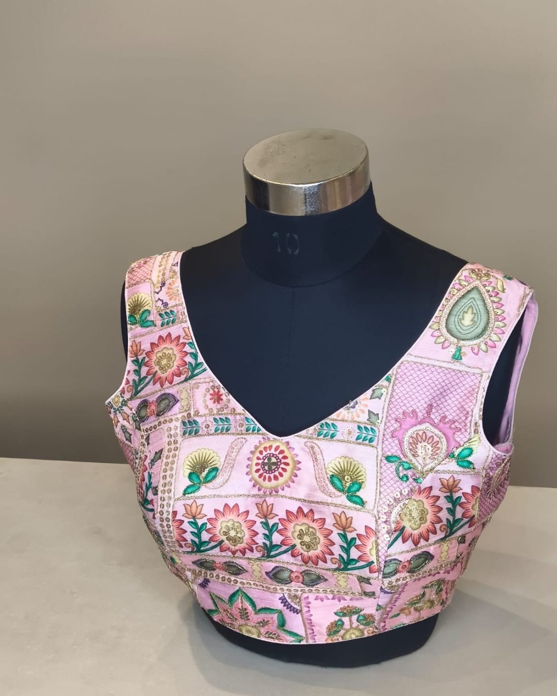 Pink Floral Print Blouse photographed on a dress form at the Ananta Designs boutique