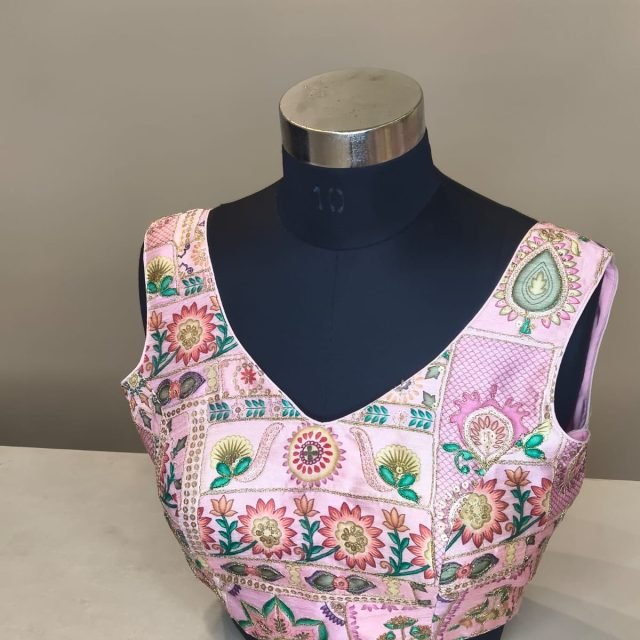 Pink Floral Print Blouse photographed on a dress form at the Ananta Designs boutique