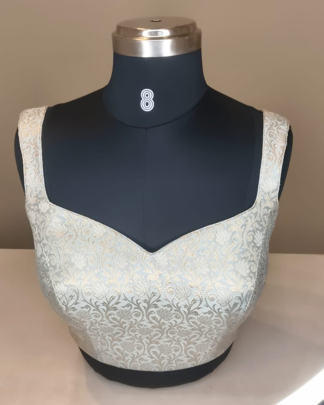 Silver Ivory Brocade Sweetheart Blouse photographed on a dress form at the Ananta Designs boutique