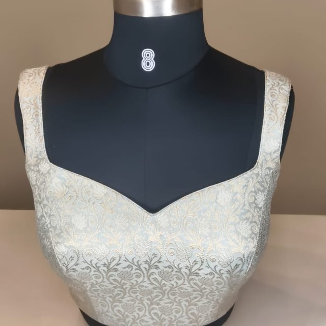 Silver Ivory Brocade Sweetheart Blouse photographed on a dress form at the Ananta Designs boutique