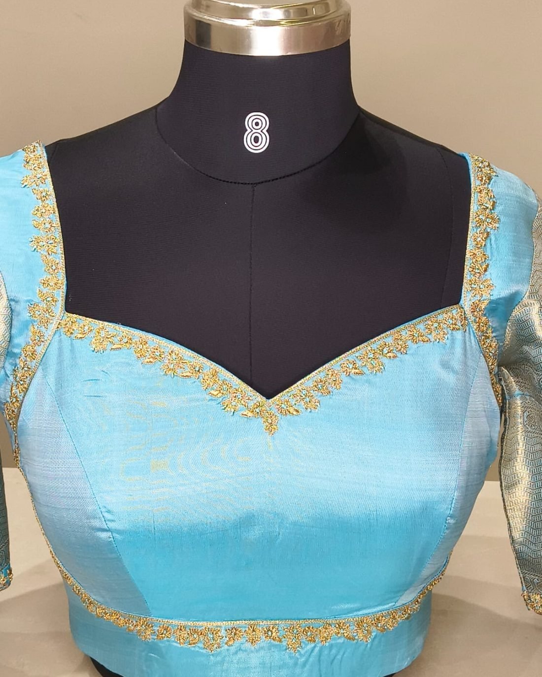 Turquoise Silk Zari Sweetheart Blouse photographed on a dress form at the Ananta Designs boutique