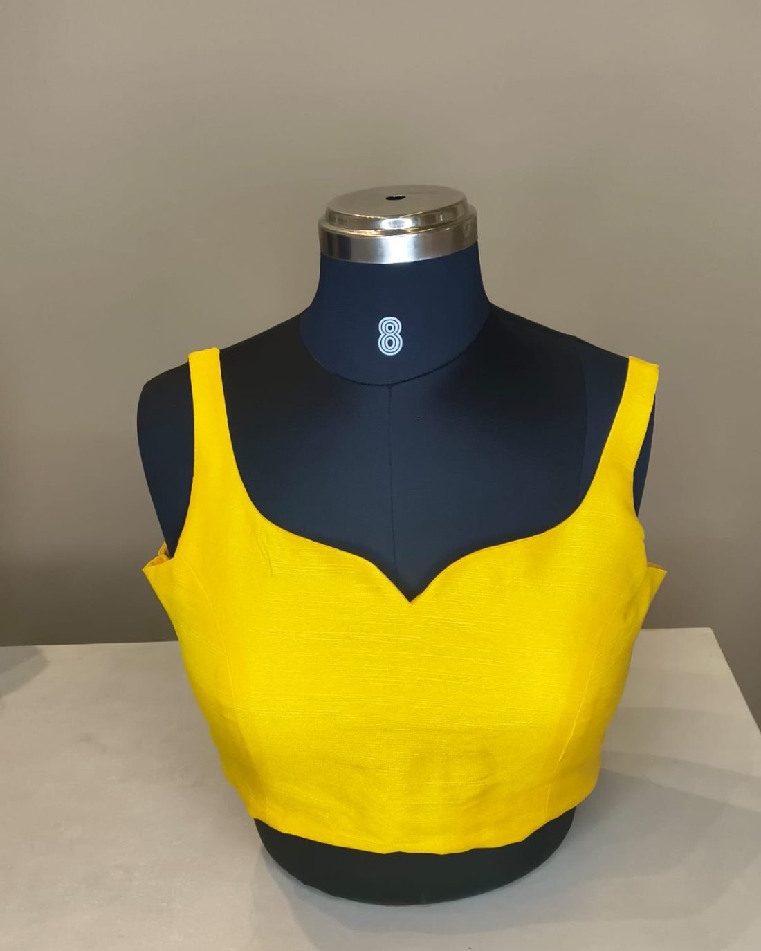 Yellow Silk Sweetheart Blouse photographed on a dress form at the Ananta Designs boutique