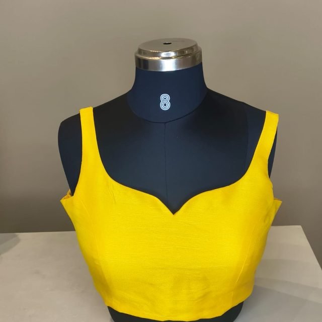 Yellow Silk Sweetheart Blouse photographed on a dress form at the Ananta Designs boutique